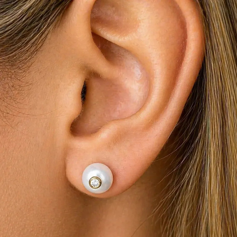 18k gold stud earrings featuring South Sea pearls with diamond accents