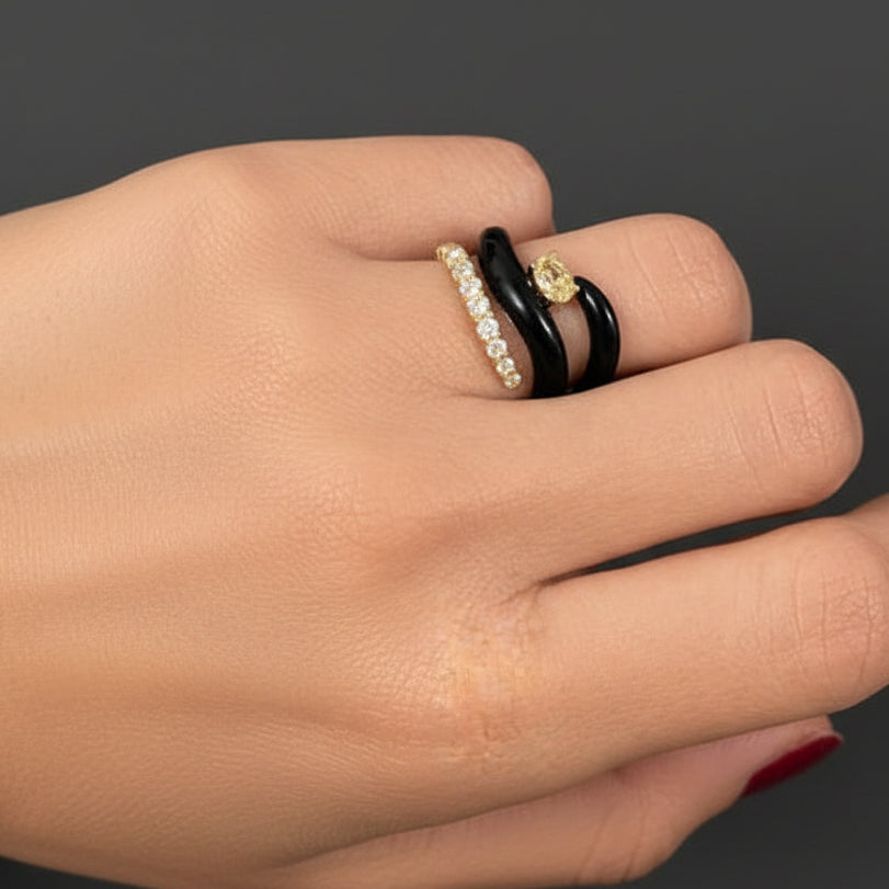 18k yellow gold open spiral ring with black agate ends and brilliant-cut diamonds totaling 0.71 carats