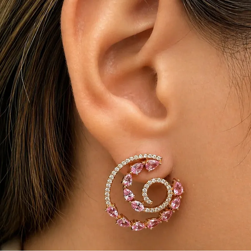 18k rose gold spiral earrings with 24 pink sapphires totaling 2.82 carats and 78 brilliant-cut diamonds totaling 0.48 carats