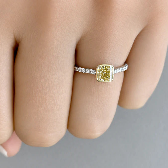 18k white gold ring with a square cut-cornered fancy yellow diamond and split-shank diamond pave