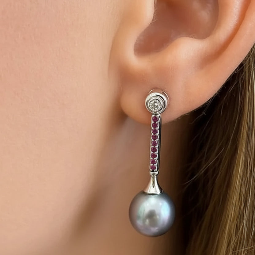 18k gold drop earrings with Tahitian pearls, ruby accents, and diamonds