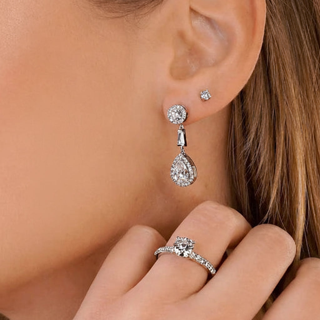 18k gold earrings with GIA pear-shaped diamonds and diamond halo dangles