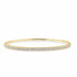 rigid 14k yellow gold tennis bangle bracelet with round diamonds encircling the band