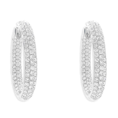 18k white gold hoop earrings with three rows of diamonds on inner and outer surfaces