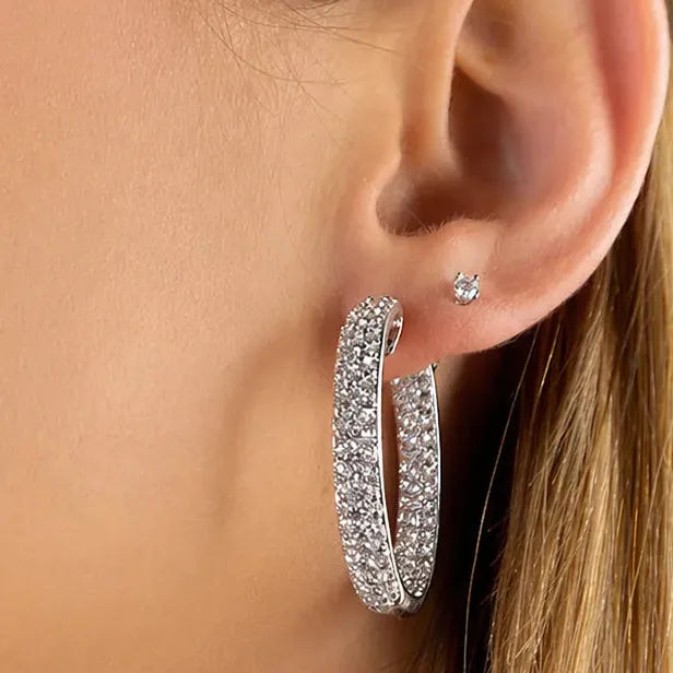 18k white gold hoop earrings with three rows of diamonds on inner and outer surfaces