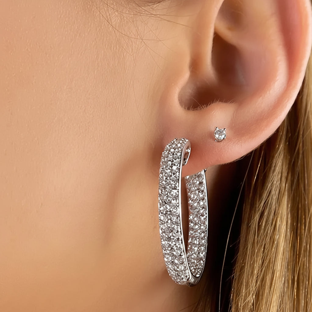 18k white gold hoop earrings with three rows of diamonds on inner and outer surfaces