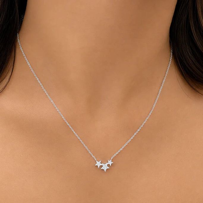 14k gold necklace with three star-shaped diamond accents