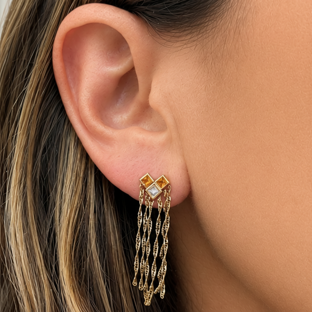 18k yellow gold earrings with yellow sapphires, diamonds, and chain drops