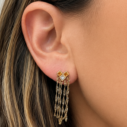 18k yellow gold earrings with yellow sapphires, diamonds, and chain drops