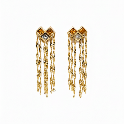 18k yellow gold earrings with yellow sapphires, diamonds, and chain drops