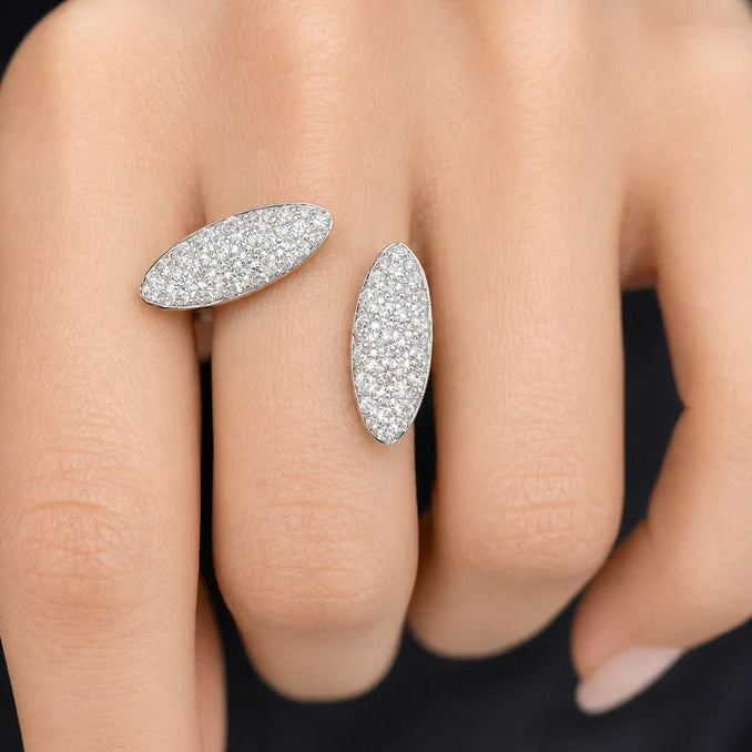 18k gold ring featuring two oval pave diamond clusters side-by-side