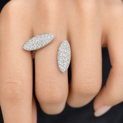 18k gold ring featuring two oval pave diamond clusters side-by-side